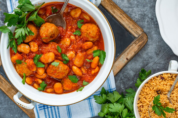 Pork meatballs in tomato sauce with couscous