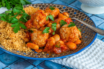 Pork meatballs in tomato sauce with couscous