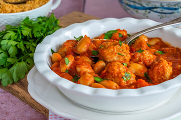 Pork meatballs in tomato sauce with couscous