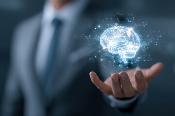 Businessman holding a holographic brain