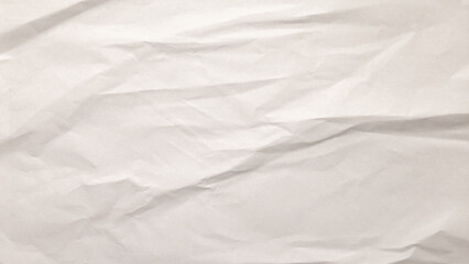 Crinkled white paper fills the view, showcasing its texture and subtle variations. This background offers a neutral canvas suitable for creativity and design work