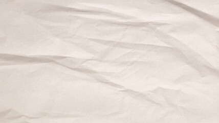 A textured beige paper surface features prominent crumples. The natural imperfections create a rustic, artistic backdrop suitable for various creative applications