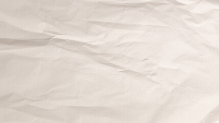 A crumpled white paper surface showcases intricate textures under soft, even lighting, perfect for artistic designs or craft work in a creative studio environment