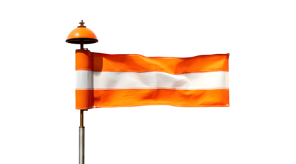 A windsock with orange and white stripes against a white background on a sunny day outdoors