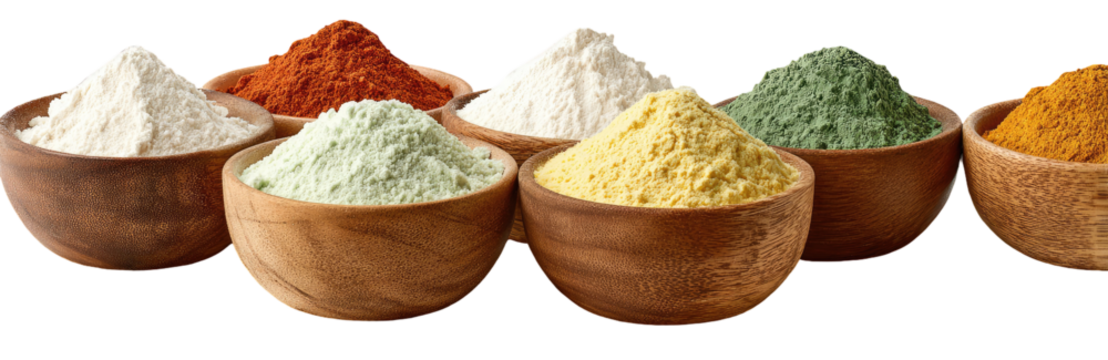 Wooden bowls filled with various colorful powders