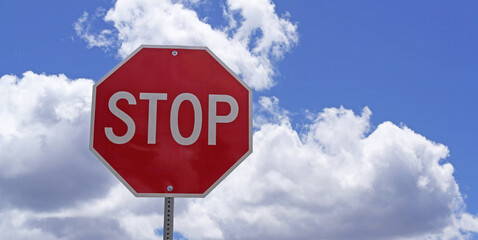 stop sign against blue sky