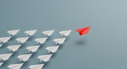 Red paper airplane leading a group of white paper airplanes, symbolizing leadership, innovation, and individuality.