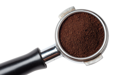 Close-up of freshly ground coffee in a portafilter on a white background.
