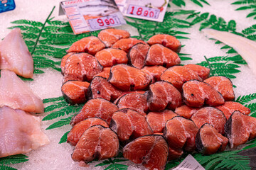 Neatly arranged salmon slices on ice at a market counter in Mercado de la Ribera, Bilbao – showcasing freshness, quality, and the vibrant appeal of Basque seafood culture.

