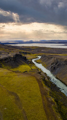 Aerial View of Winding River and Rugged Canyon in Iceland