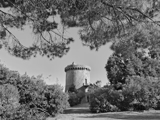 Scenic black and white view of the Albidona tower in Calabria