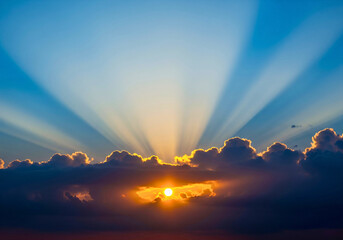 Sky Burst: Capturing the sun breaking through clouds and creating a beautiful ray of light in the sky.