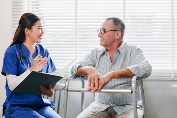 Obraz premium Friendly nurse speaking with senior man using walker, warm caregiving moment in clinic