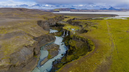 Aerial View of Icelandic Canyon with Waterfalls and Winding River