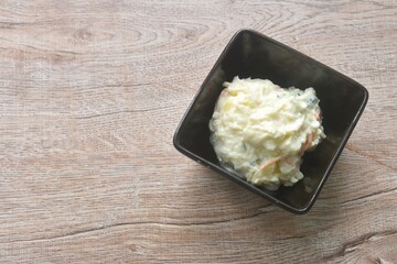 baked mashed potato with boiled egg salad dressing japanese sauce on bowl