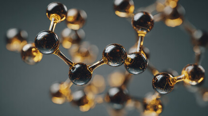 Amber spheres connected by thin rods forming a complex molecular structure against a gray background