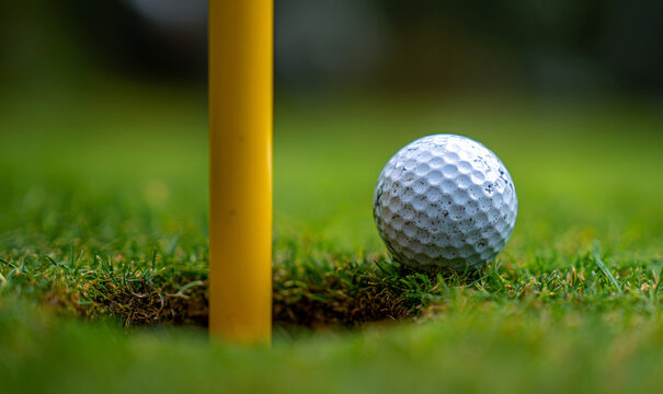 Close Up of Golf Ball About to Enter Hole
