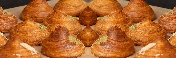 Mini croissant pattern. French puff pastries, chocolat bakery