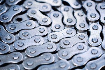 Bicycle chain closeup. Metal silver links pattern. Industrial detail of mechanism. Macro view of chain texture background. Mechanical parts and gear concept. Technology detail for bike repair.
