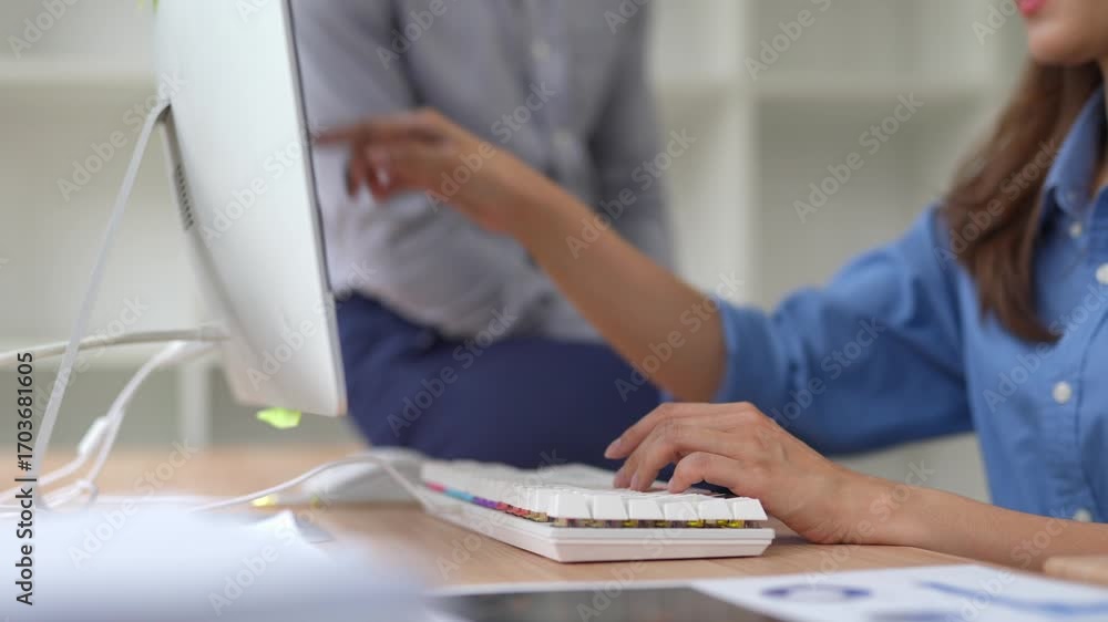 Poster two businesswomen collaborate on a project, discussing strategies and analyzing data on a desktop co