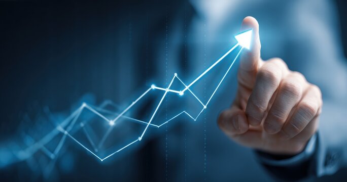 Business hand pushing upward trend graph