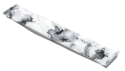 Long, flat, white object with dark ink blotches