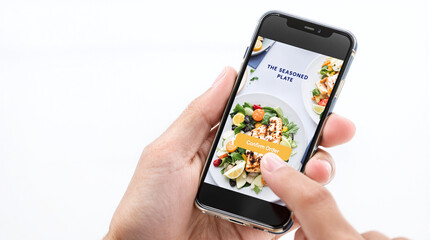 Hand Tapping Healthy Food Delivery App on Smartphone Screen
