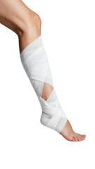 Close-up of a wrapped lower leg.  A woman's leg is bandaged with white material.  The bandage is wrapped around the lower leg and ankle