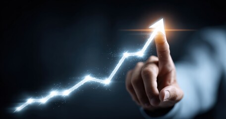 Hand pushing a glowing upward trend graph