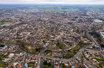 An aerial panoramic view around the old town of the city Beaune in France on a sunny day in early spring