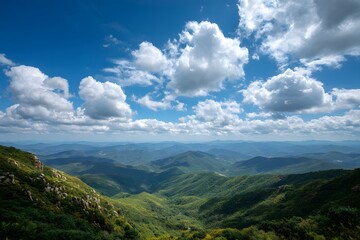 Fototapeta premium Verdant mountain range under blue sky mountains green