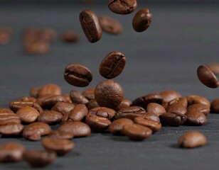 Coffee beans falling onto a dark surface