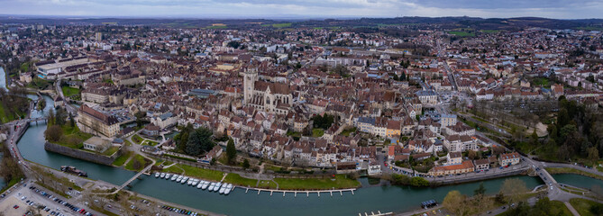 An aerial panoramic view around the old town of the city Dole in France on a cloudy day in early spring
