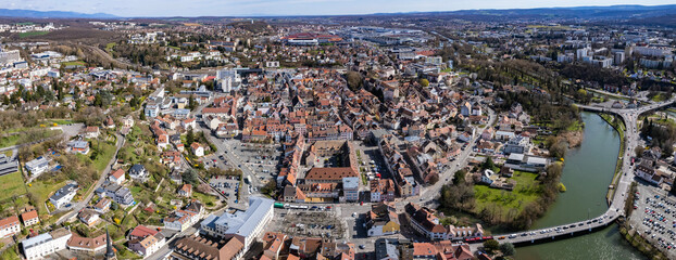 An aerial panoramic view around the old town of the city Montbéliard in France on a sunny day in early spring