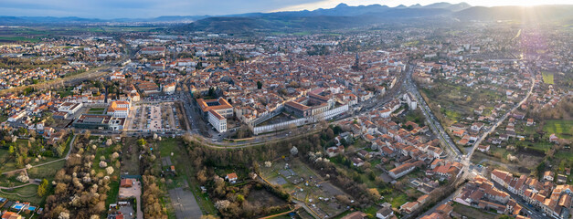 An aerial panoramic view around the old town of the city Riom in France on a sunny day in early spring