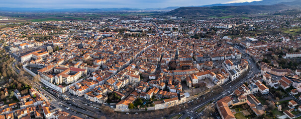 An aerial panoramic view around the old town of the city Riom in France on a sunny day in early spring