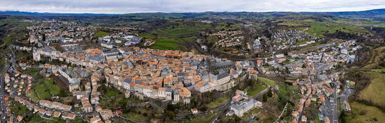 An aerial panoramic view around the old town of the city  Saint-Flour in France on a sunny day in early spring
