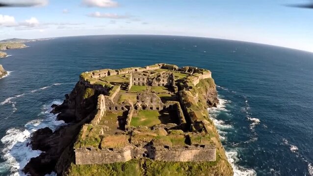 Aerial View of Historic Castle Ruins Perched on a Coastal Cliff Overlooking the Sea