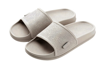 Pair of modern spa slide sandals in muted gray tone, soft matte texture, perforated wide band and overlapped layout, isolated on transparent background.

