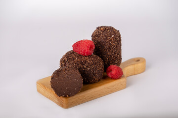 cocoa and raspberry cake on a board, copy space