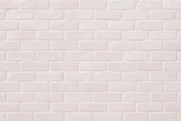 Fototapeta premium Brick Wall Texture: A close-up view showcases the texture of a classic brick wall, perfect for a range of design needs. The rough, textured surface of individual bricks is illuminated.