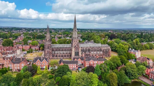 A receding aerial view of the cathedral in the town of Lichfield, UK in summertime