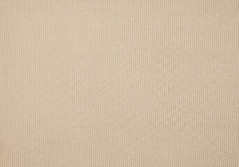 Fototapeta premium Closeup of a beige fabric texture, showcasing its intricate weave and subtle variations in color and tone