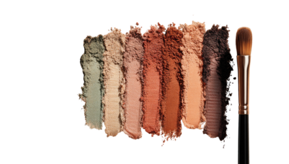 Close-up of eyeshadow palette swatches with makeup brush