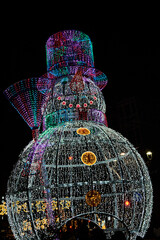 Giant snowman sculpture glowing brightly at the famous Christmas lights in Vigo