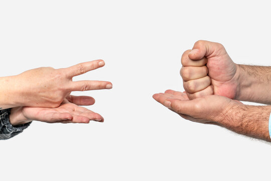 Hands playing rock paper scissors game
