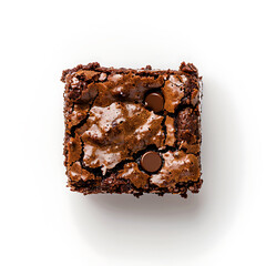 A close-up overhead view of a chocolate brownie with cracked surface and embedded chocolate chips on a white background.
