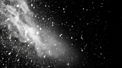 A black background with a concentrated area of white specks and streaks, resembling falling snow - Powered by Adobe