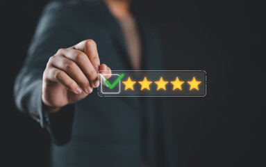Businessman holding stylus marking five-star rating. Concept of customer satisfaction, feedback, online review, and quality service.