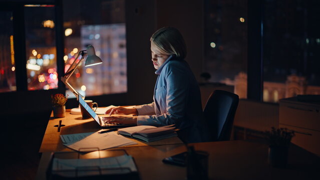 Busy manager night call workplace texting laptop closeup. Businesswoman talking